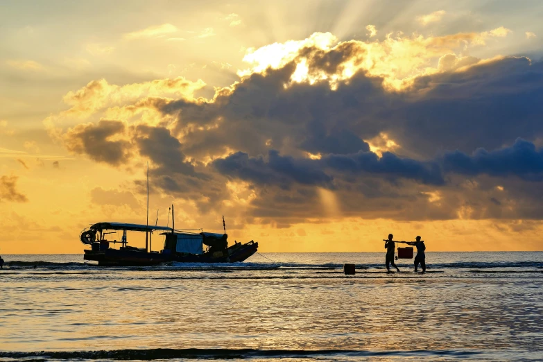 a boat is approaching a person standing in the water