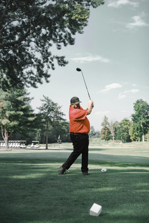 a person is practicing hitting a golf ball