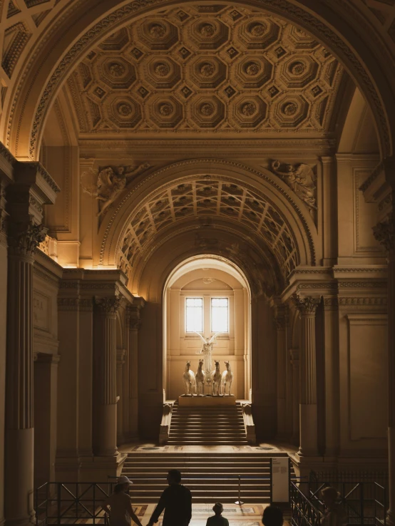 a po taken through an arched doorway to the interior of a building