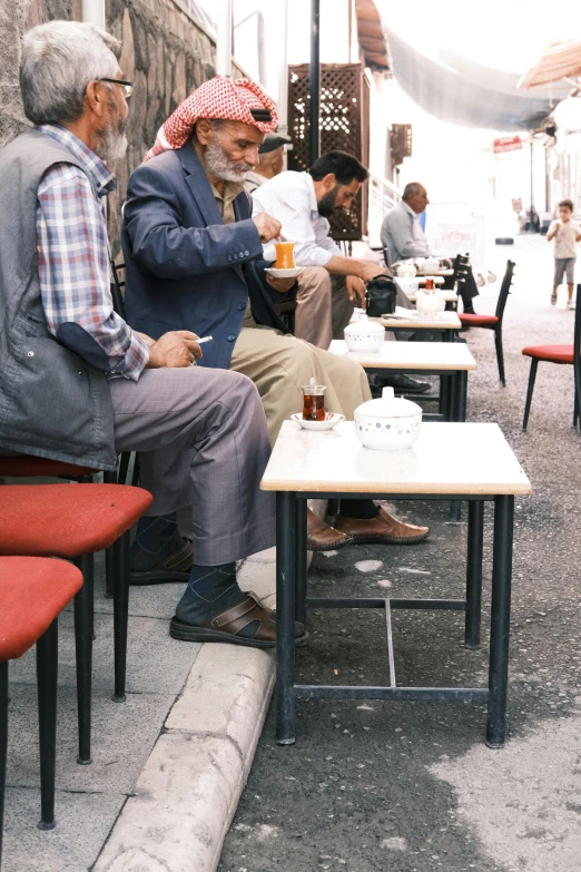 people sitting in different seats at a restaurant