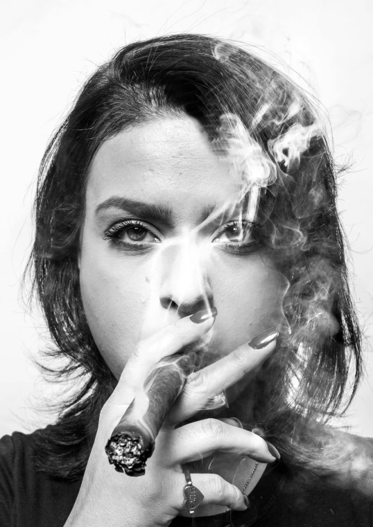 the woman smokes a cigarette while wearing a watch