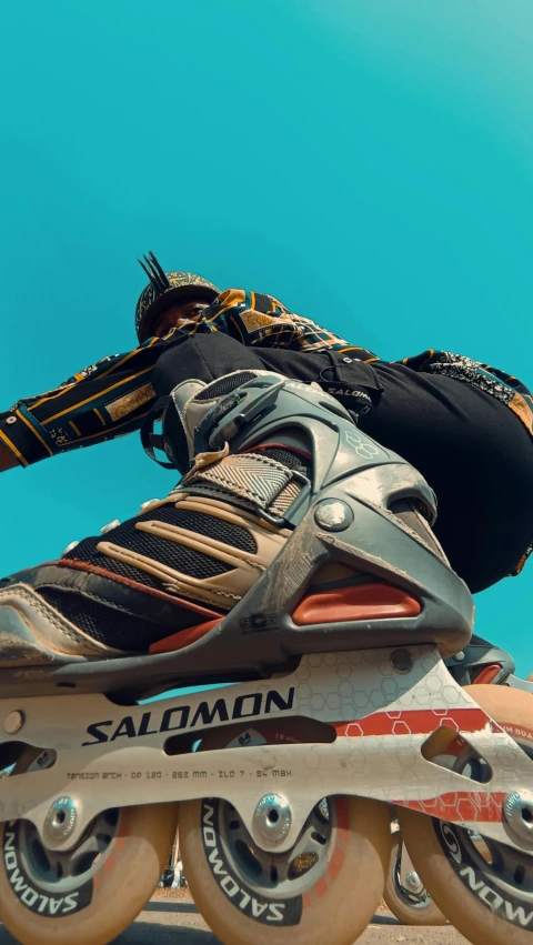 a person wearing skis on top of roller blades