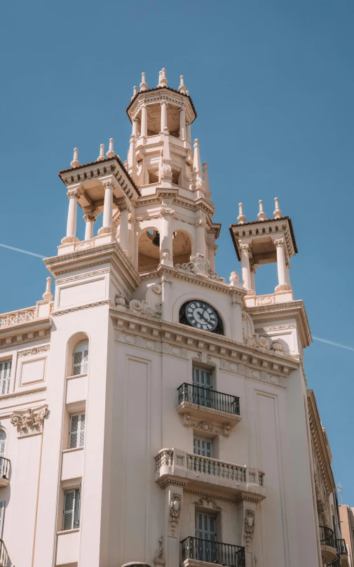 a large tall building with a clock on the top