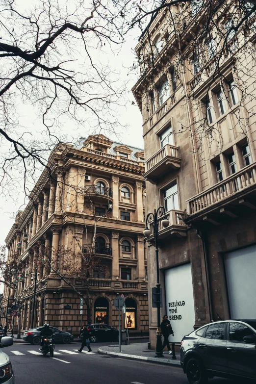 a street view of a building and cars parked on the side of the street