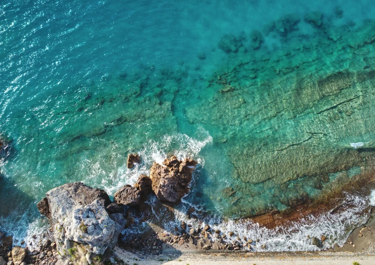 an aerial view of a beach and water