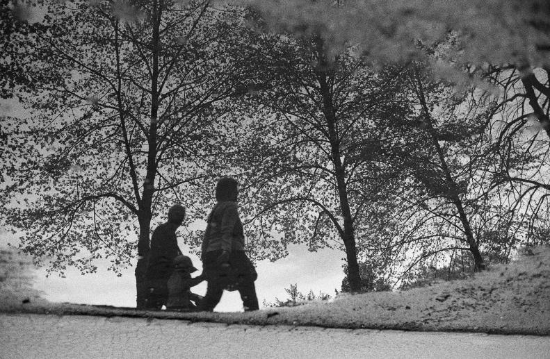 two women walking in the woods at night