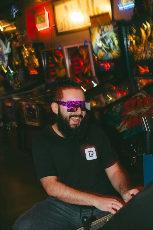 a man sitting in front of a table wearing 3d glasses