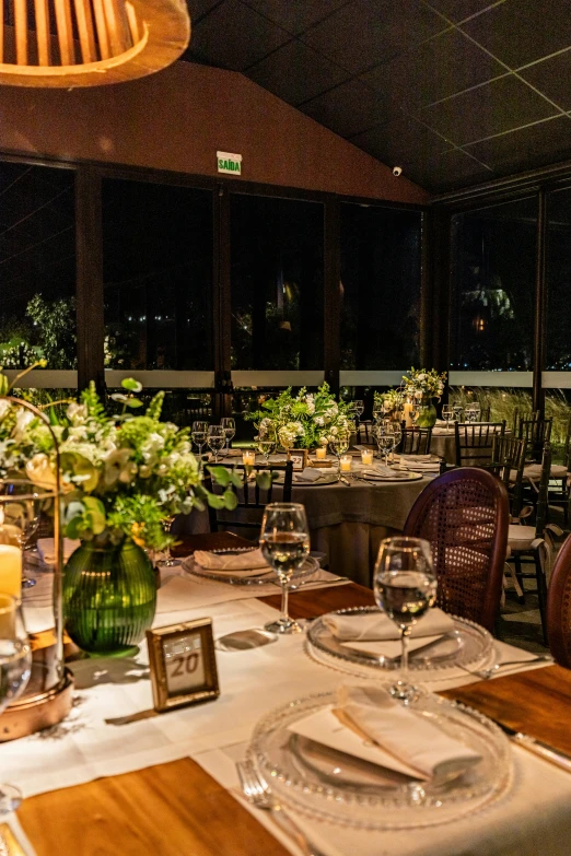 a table with plates, silverware and glasses