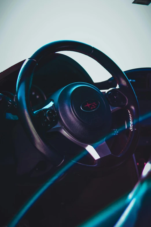 a car dashboard is shown with steering wheel and lights