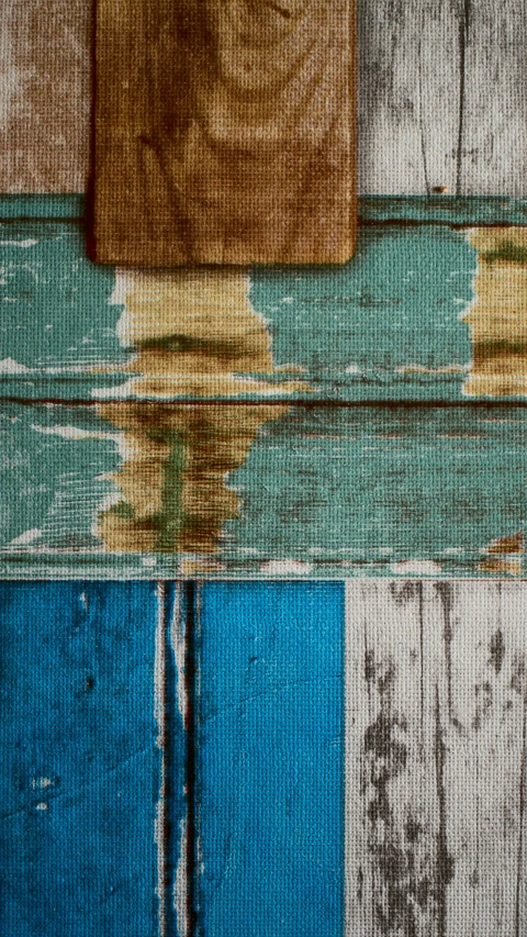 wooden paneling with paint and a wooden block