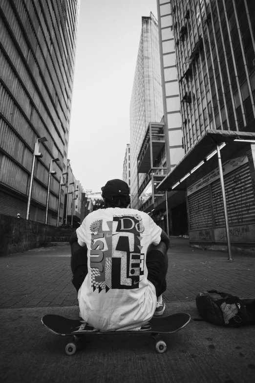 a person with skateboard sitting on the ground