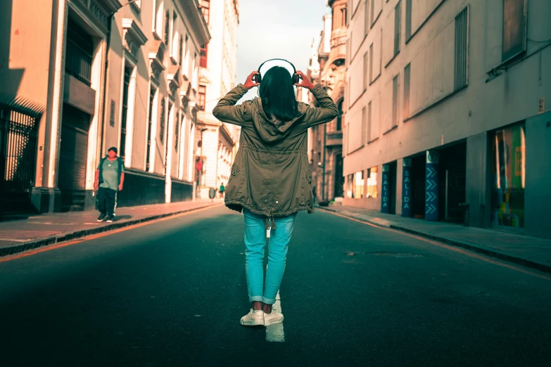 a person walking on an alley in a city