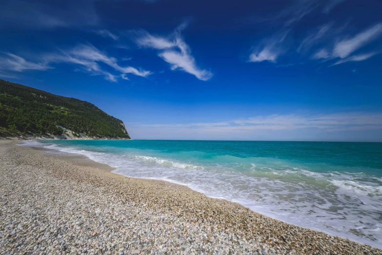 the shoreline at a rocky beach overlooks the ocean