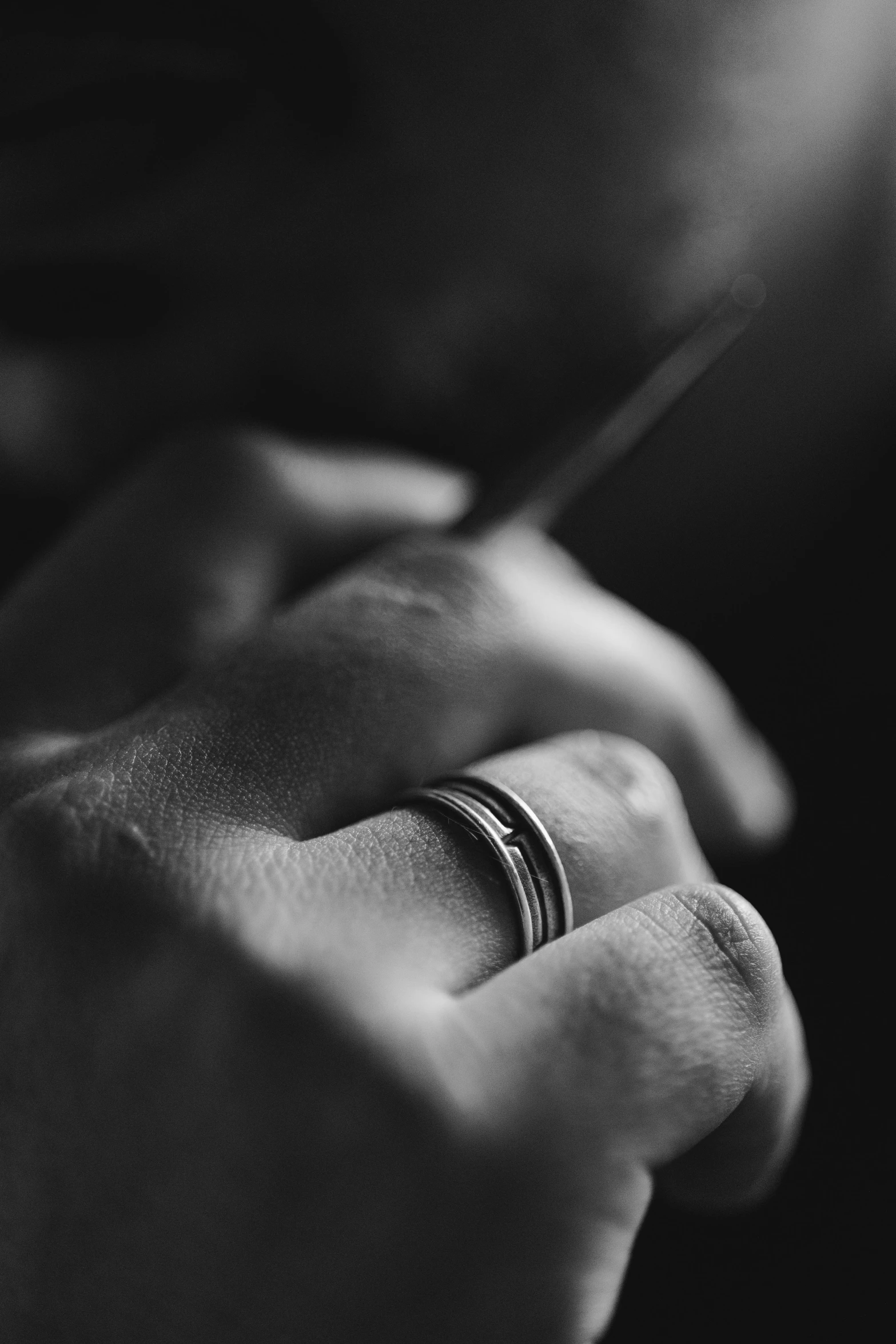 an image of a person holding a wedding ring