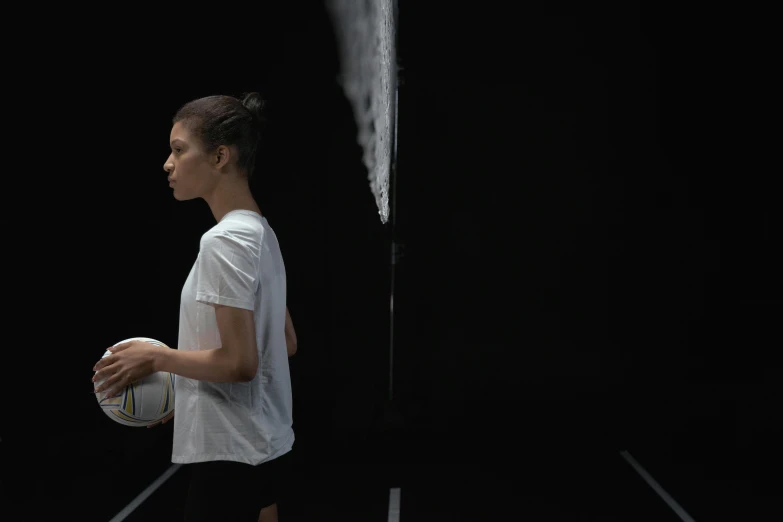 a woman is standing outside with her tennis racket in hand