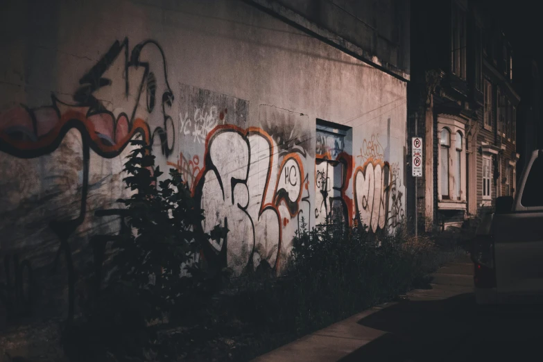 a wall with lots of graffiti on it