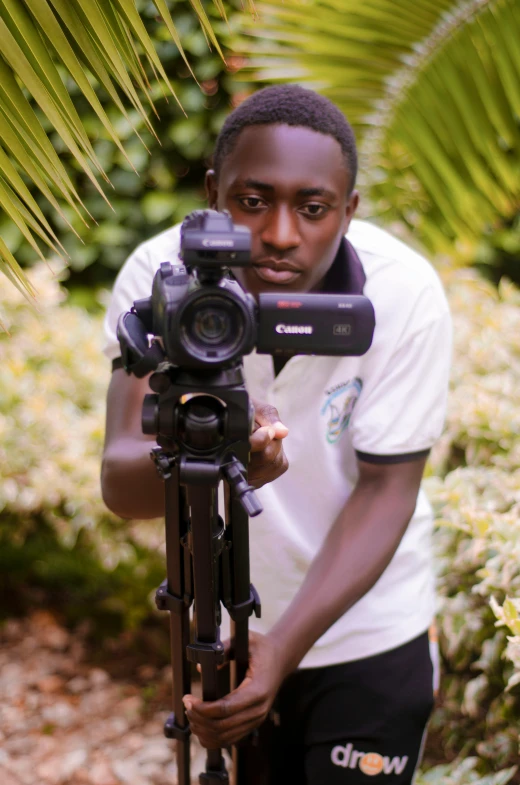 a man is holding a camera in his hands