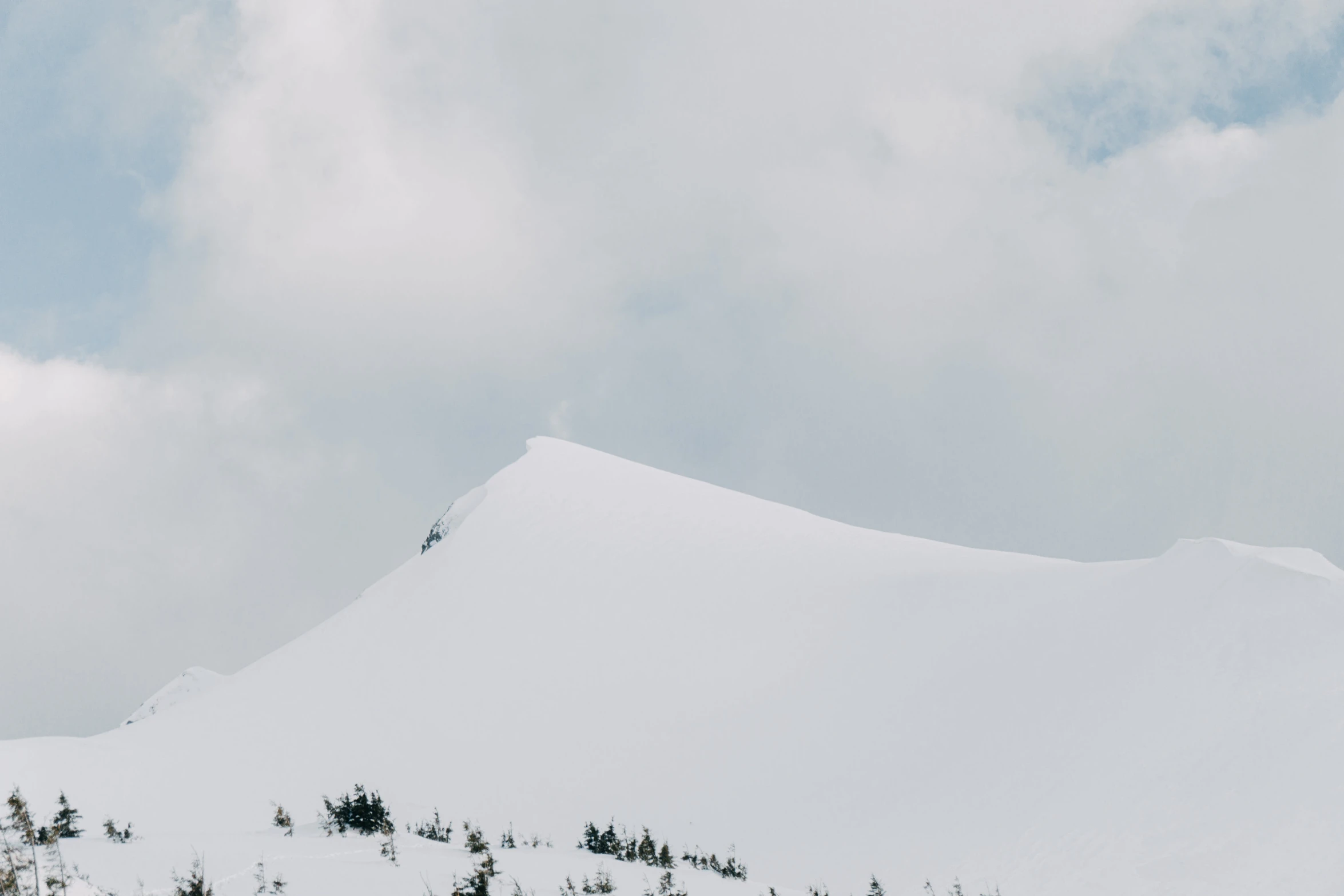 a man is skiing down a snowy mountain