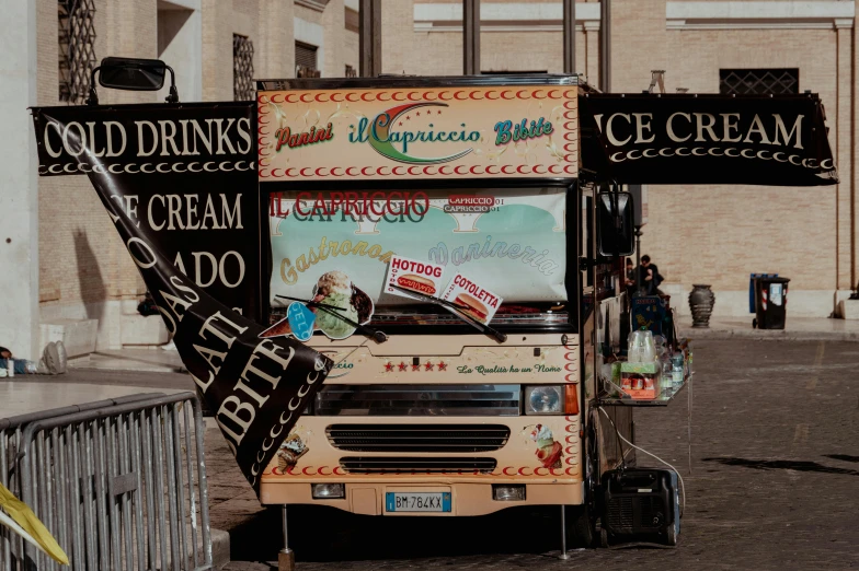 an ice cream truck parked outside in a city