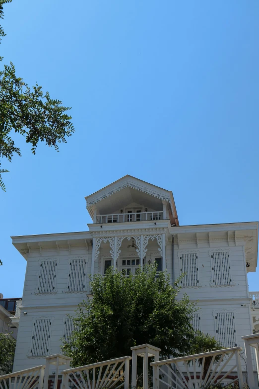 a very large house with lots of windows on the front