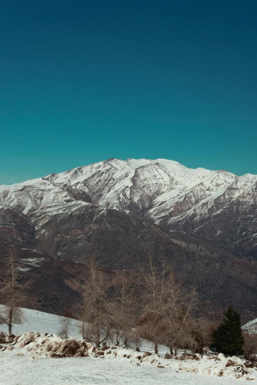 a snow covered hillside and hill covered with snow