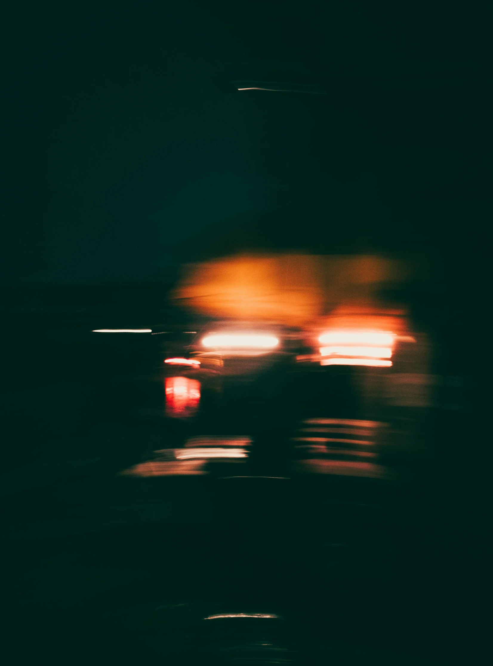 a blurry image of cars driving at night