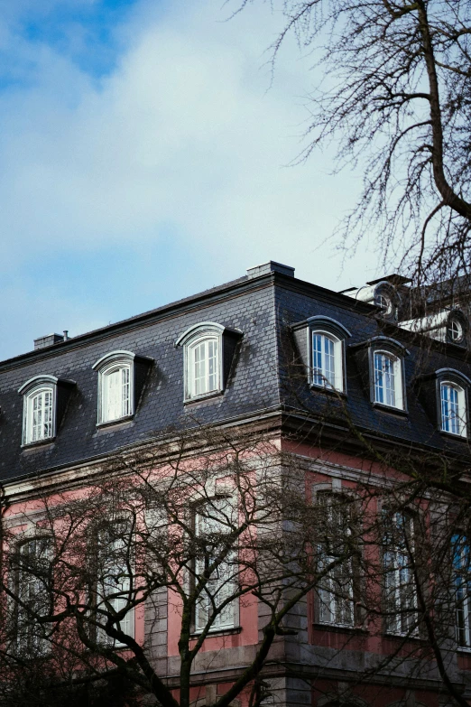 a very tall building with lots of windows on top