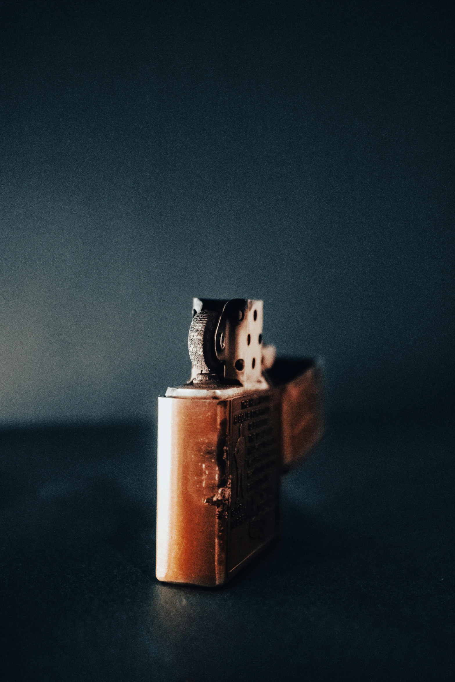 a cat sitting inside of a brown leather box