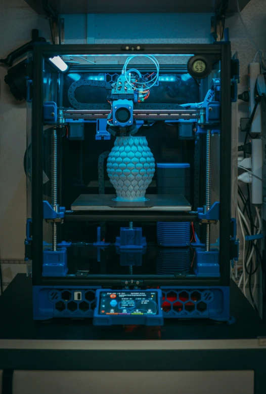 a close up of a 3d printer being worked on