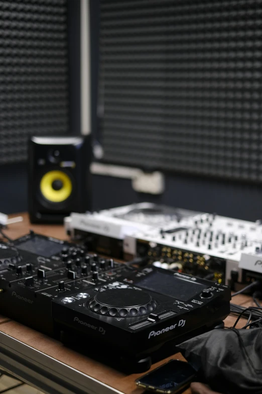 an electronic control panel is lined up on the desk