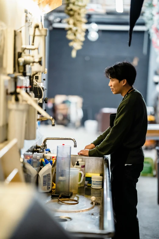 a man standing at the side of a food truck