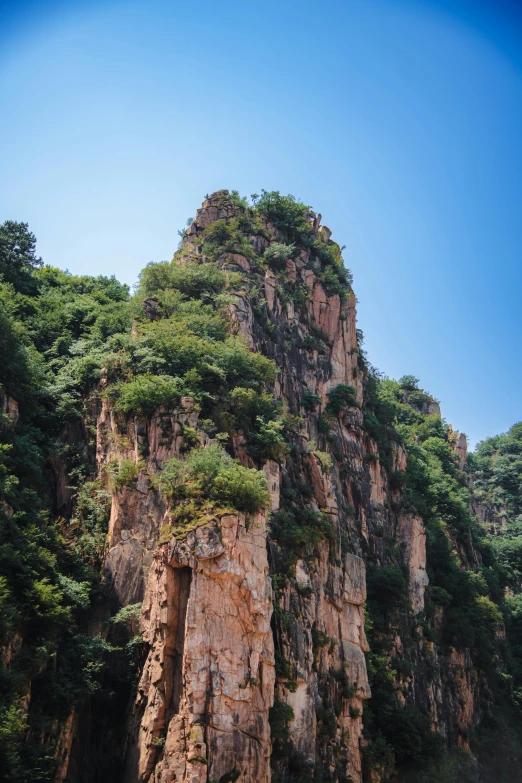 a person on a boat in a body of water with rocks