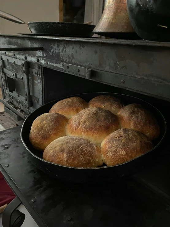 this is a metal dish full of rolls