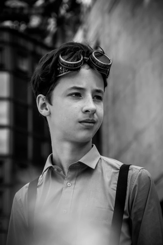 a boy wearing goggles with a backpack