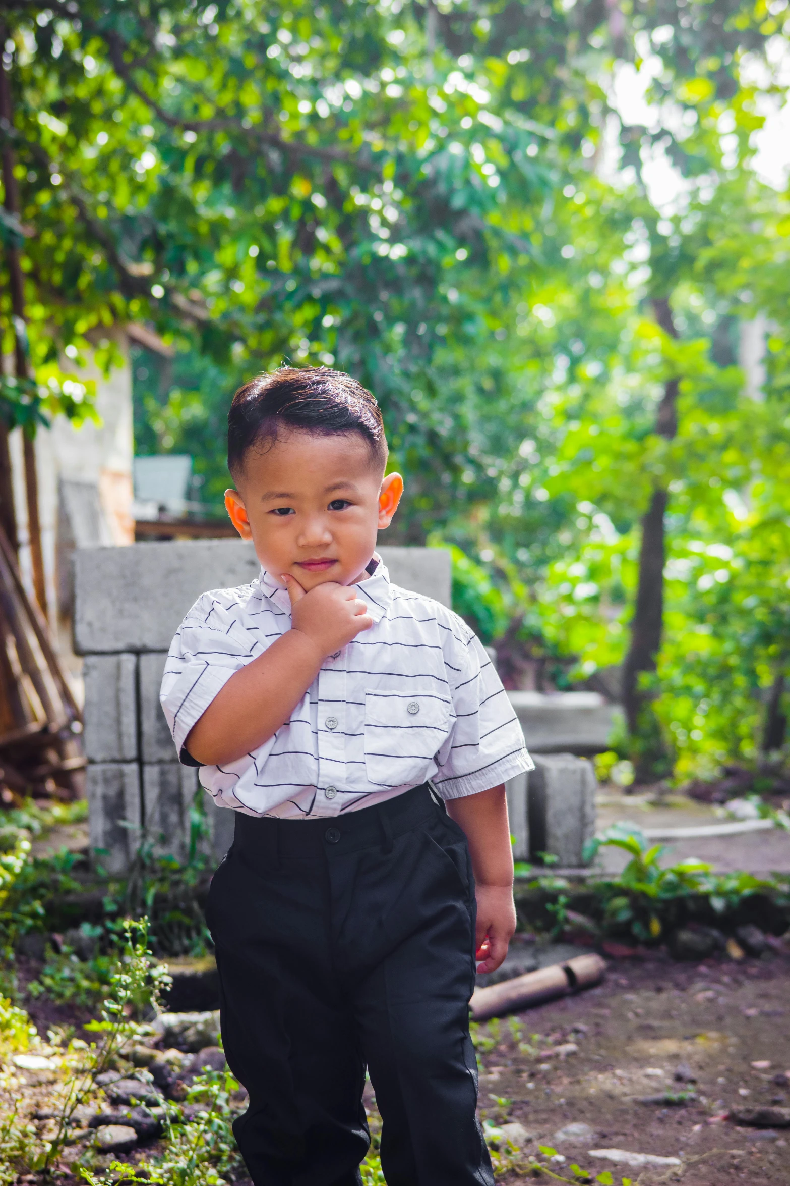 an image of a boy posing for the camera