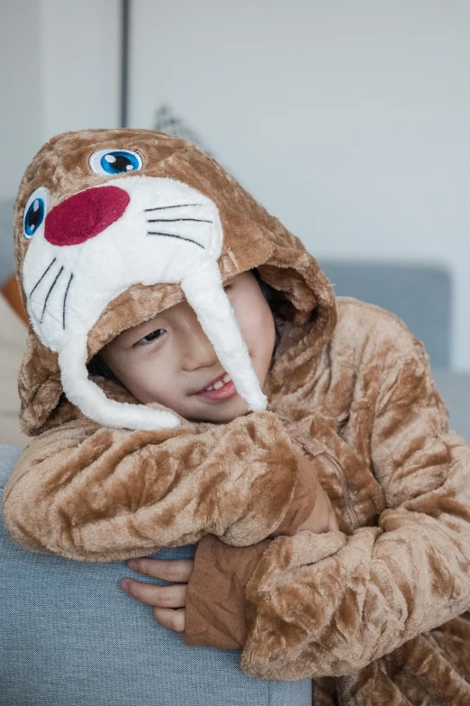 a  wearing a brown and white animal costume