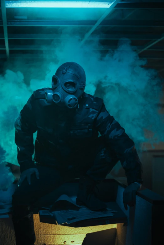 the man is dressed in a full body suit surrounded by smoke