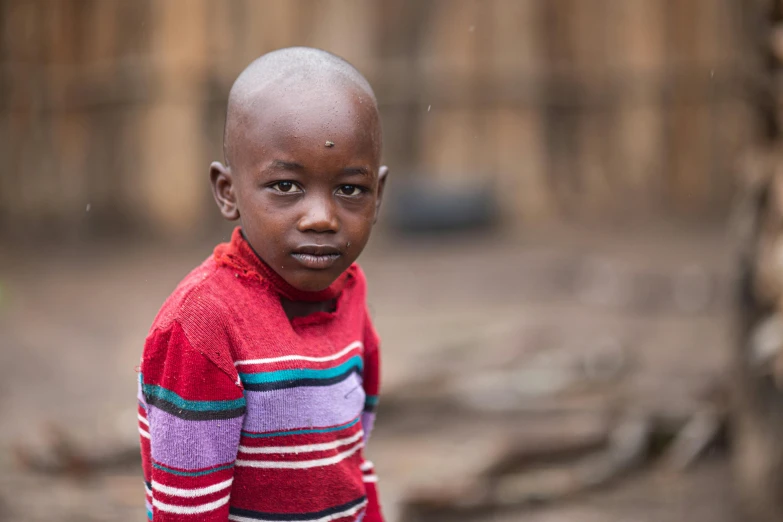 an african american child with a serious expression