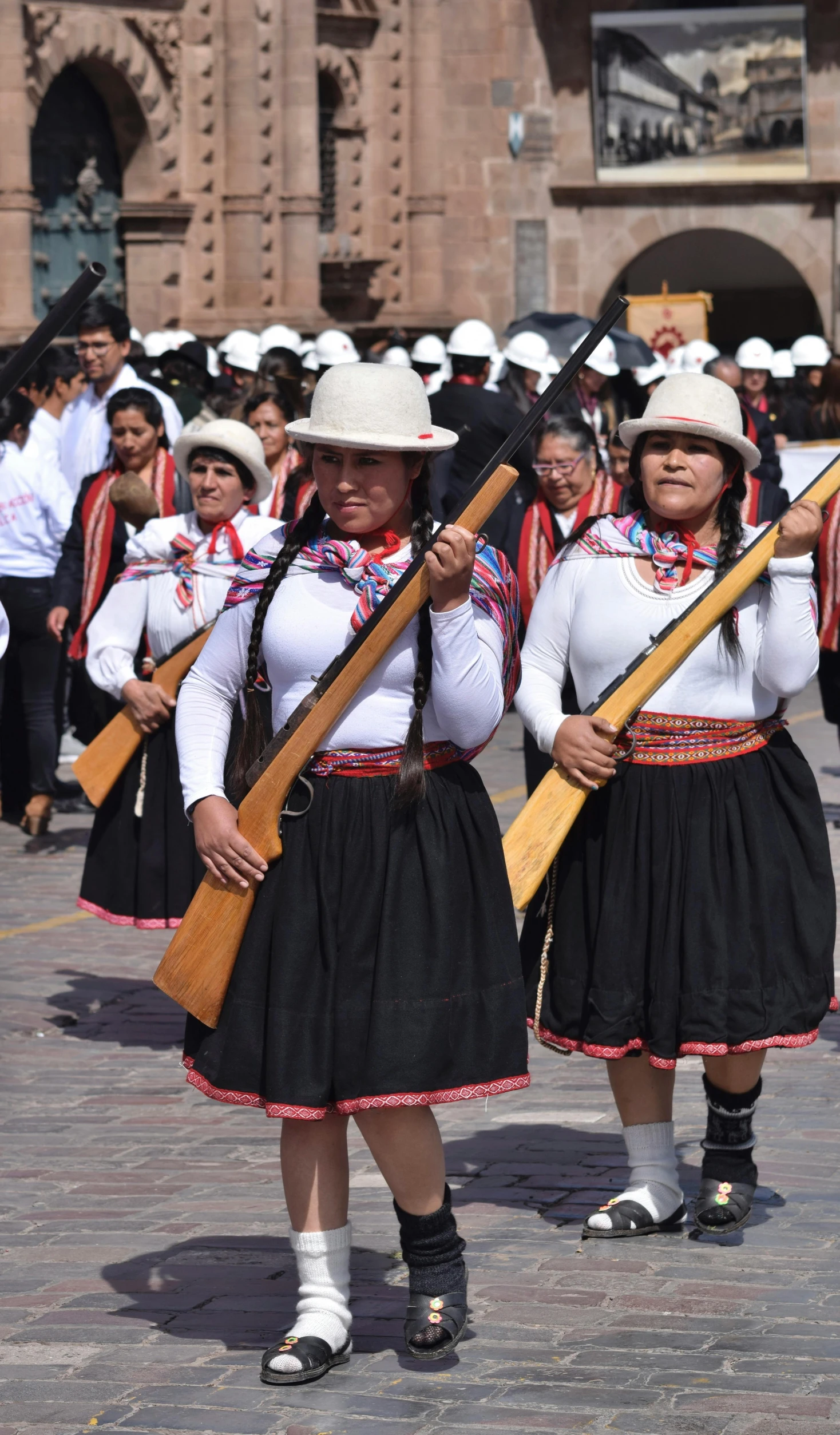 a group of people standing around with guns