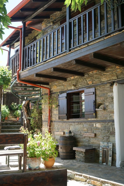 an outdoor area with several pots and plants