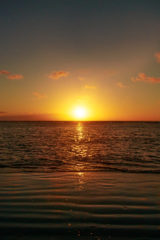 a sunset view of a body of water