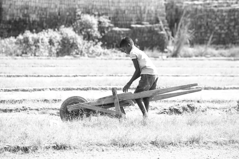 a  playing with a wooden toy