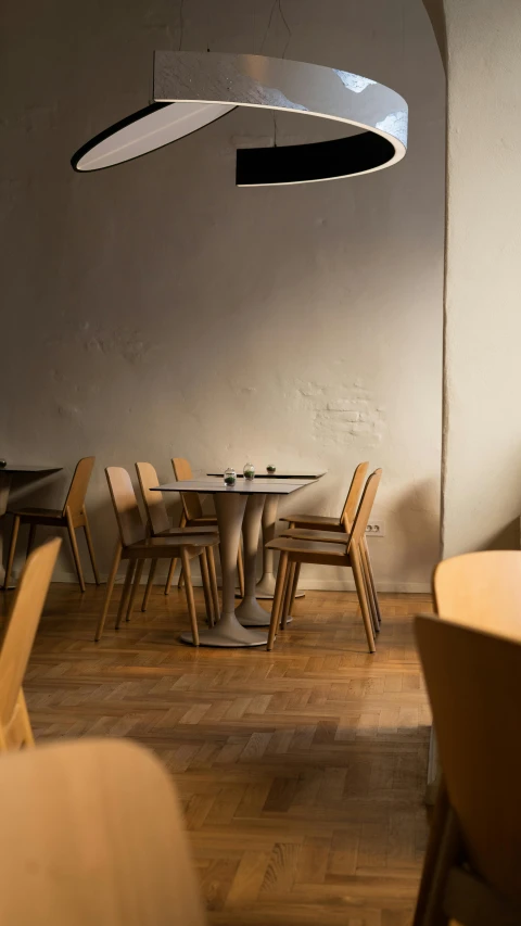 a large round table surrounded by beige chairs