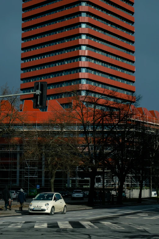 a building with an orange top and tall structure