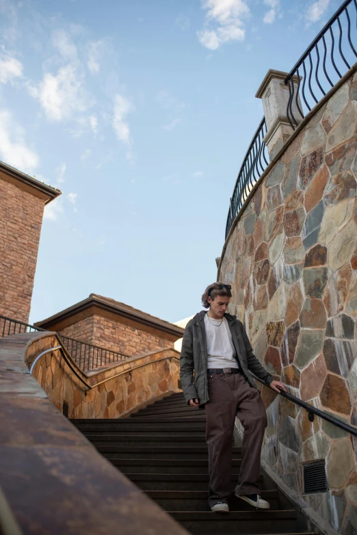 a man standing on the steps of some sort of building