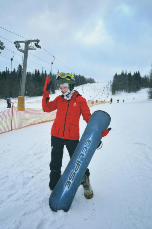 a man holding a snowboard in his hands