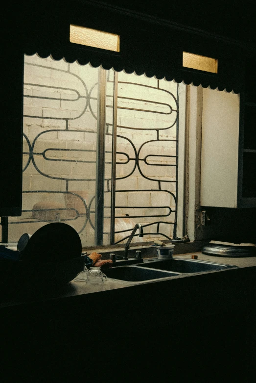 a window sill with a black cat sitting in front