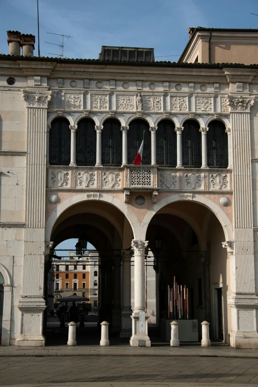 two tall building with arches and a clock tower