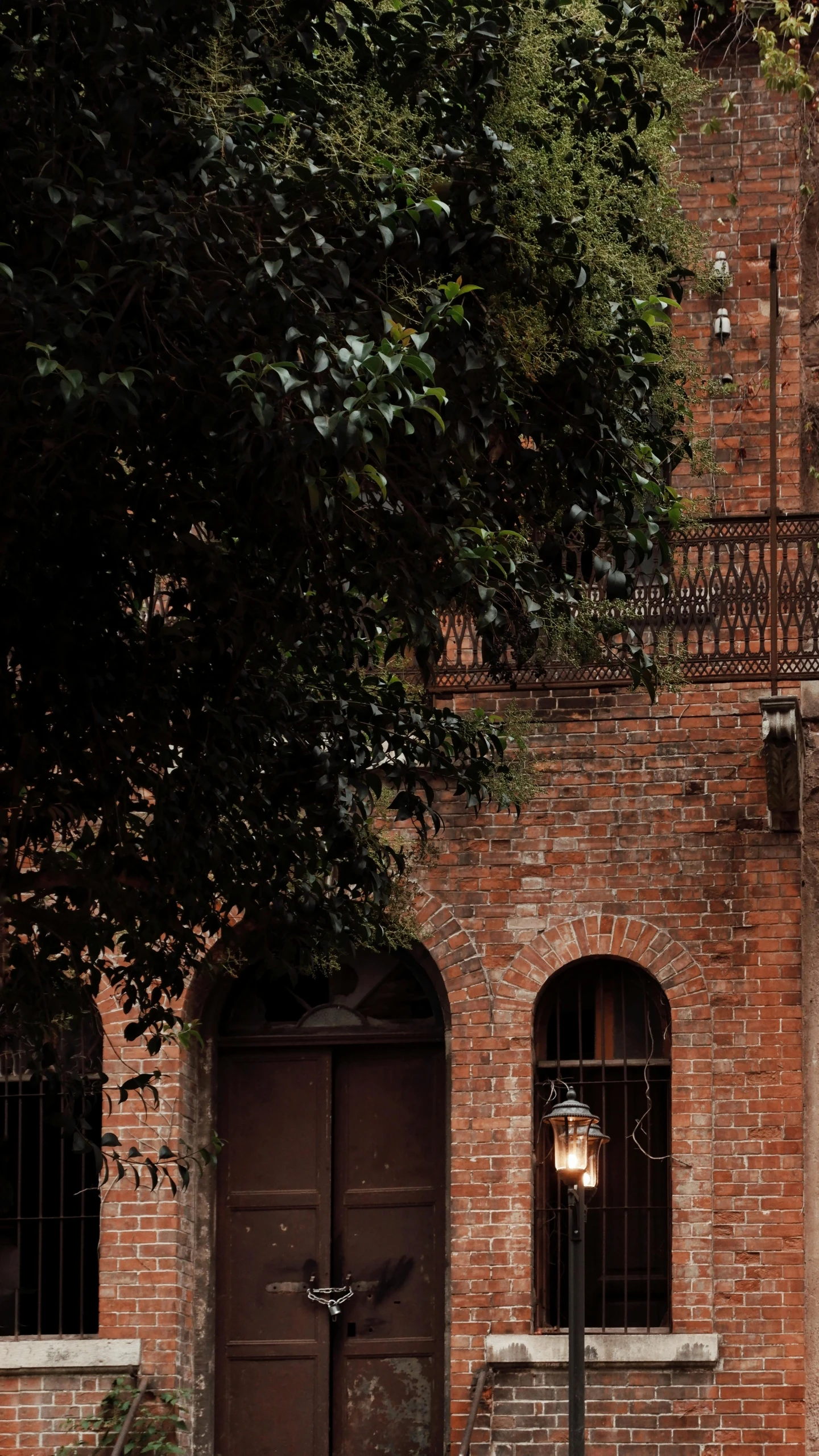 the gate to a brick building is closed