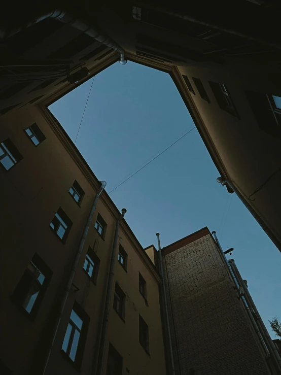 two buildings side by side with blue sky in the background